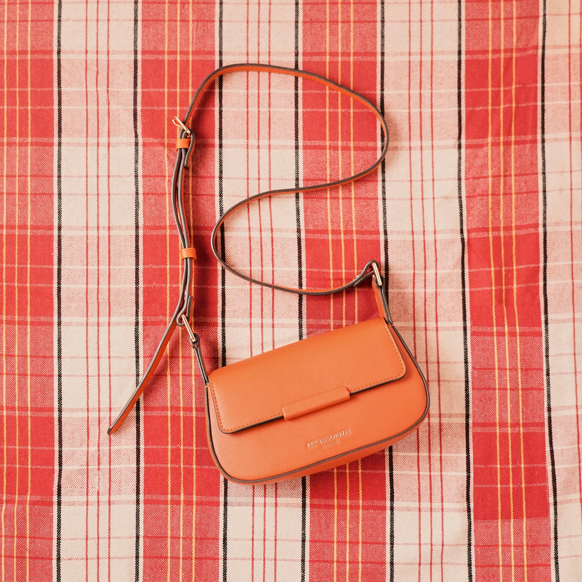 Accessorize London Women's Faux Leather Orange Small Saddle Sling Bag